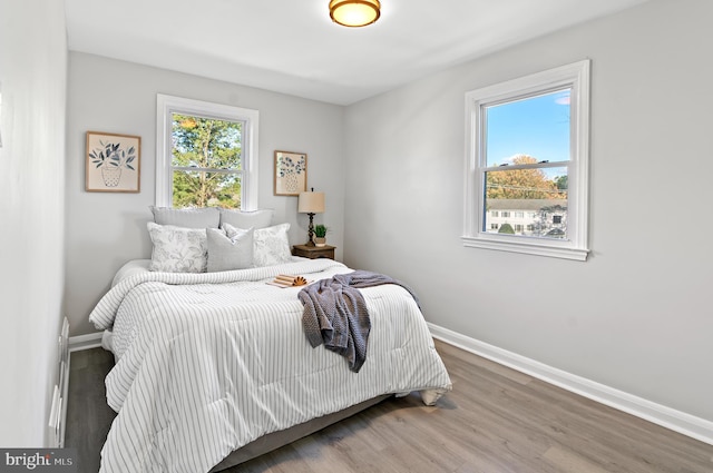 bedroom with hardwood / wood-style flooring