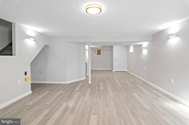 basement featuring light hardwood / wood-style floors