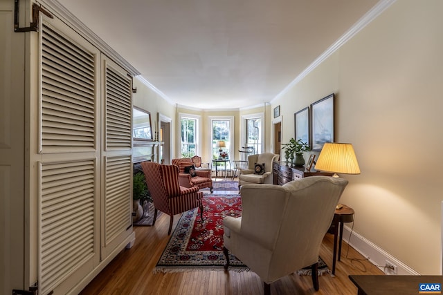 living room featuring ornamental molding and hardwood / wood-style floors