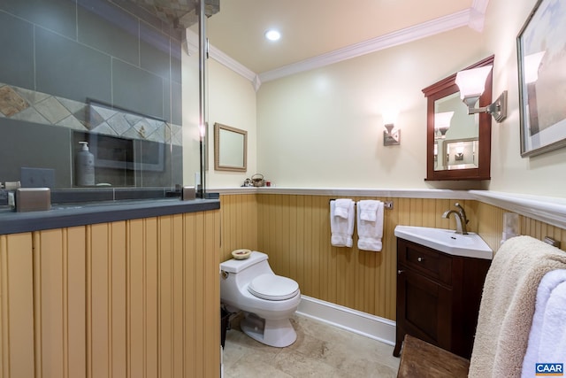 bathroom featuring vanity, toilet, wood walls, and ornamental molding