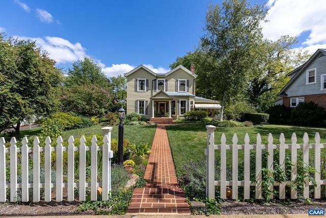 view of front of home with a porch and a front lawn