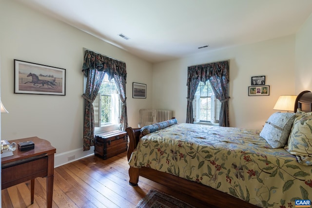 bedroom with wood-type flooring