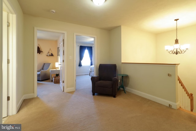 living area with light carpet and an inviting chandelier