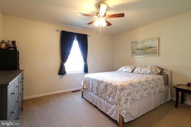 bedroom with light colored carpet and ceiling fan