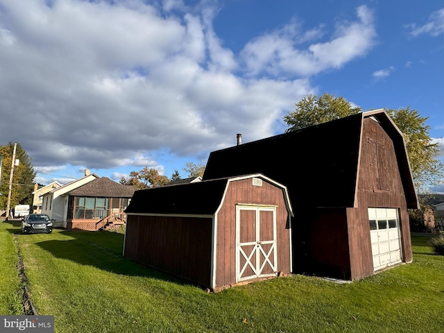 view of outbuilding featuring a lawn