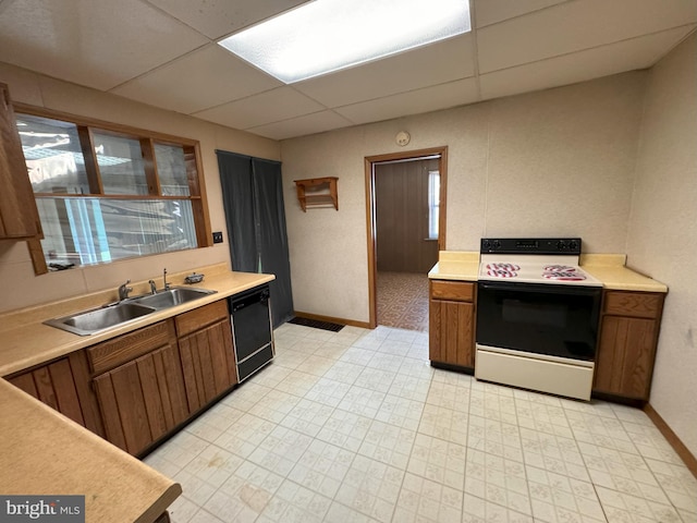 kitchen featuring sink, dishwasher, white electric range, and a paneled ceiling