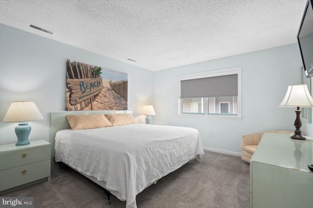 carpeted bedroom featuring a textured ceiling