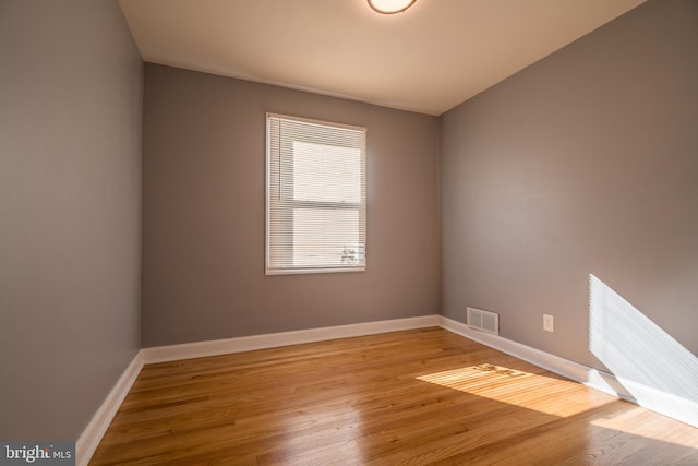 spare room featuring light hardwood / wood-style flooring