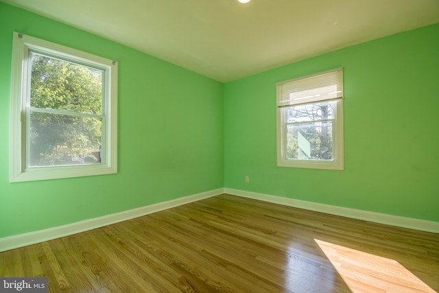 empty room with light hardwood / wood-style floors