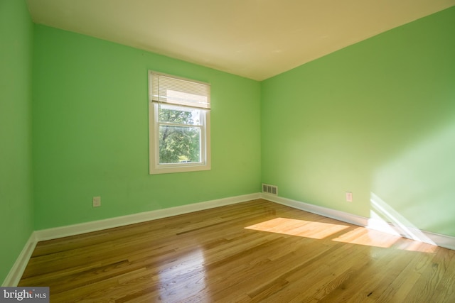 unfurnished room featuring light hardwood / wood-style floors