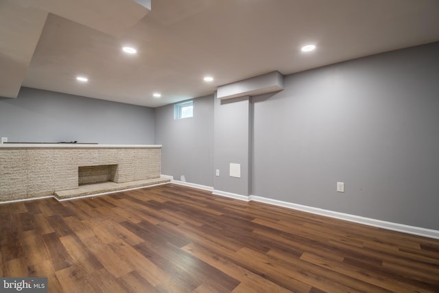 basement with hardwood / wood-style flooring