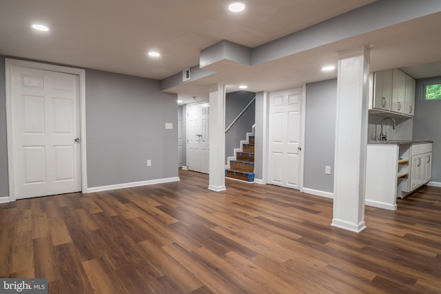 basement featuring dark hardwood / wood-style floors