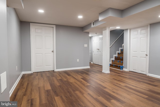 basement featuring dark hardwood / wood-style floors