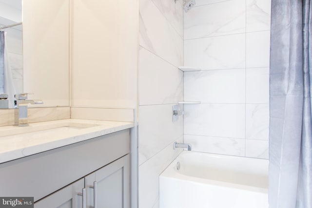 bathroom with vanity and shower / tub combo