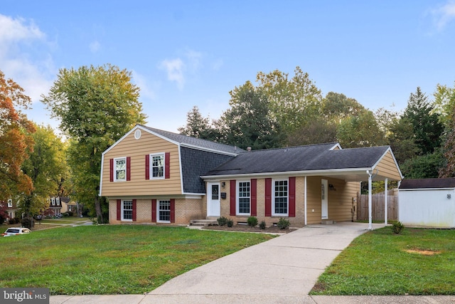 tri-level home featuring a front yard and a carport