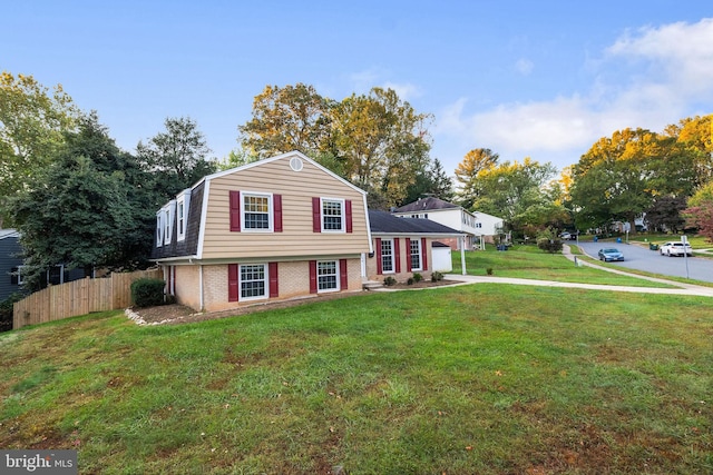 split level home featuring a front lawn