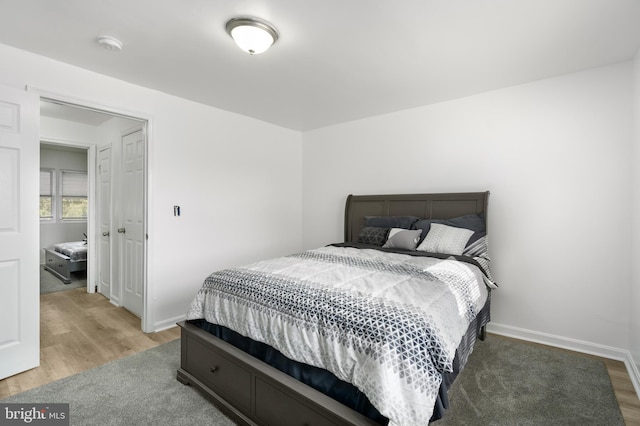 bedroom with wood-type flooring