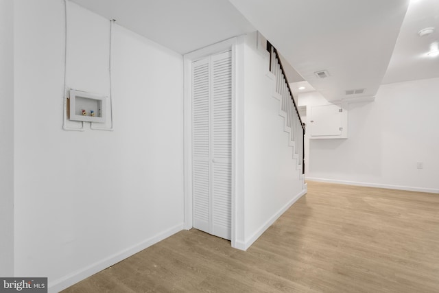 corridor featuring light wood-type flooring