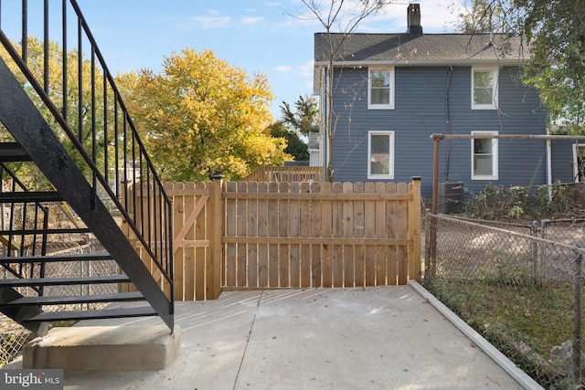 exterior space with a patio area and central AC unit