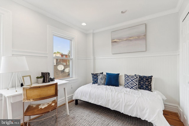 bedroom with crown molding and wood-type flooring