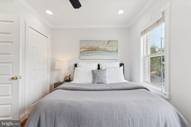 bedroom featuring a closet, ceiling fan, and ornamental molding