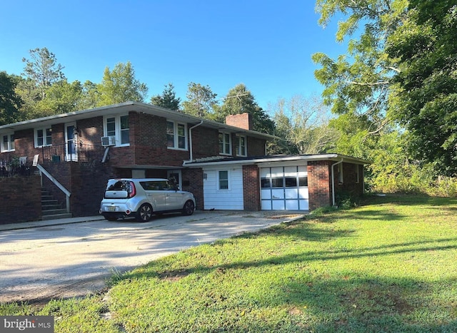 view of front of house with a front lawn and a garage