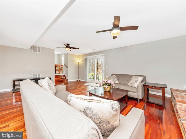 living room with hardwood / wood-style flooring and ceiling fan