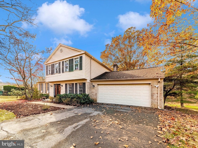 front of property with a garage