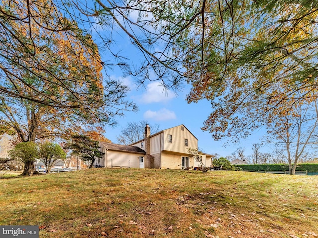 view of home's exterior featuring a lawn