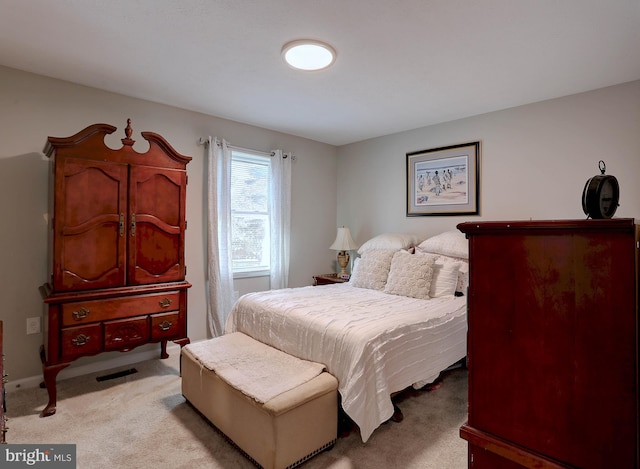 bedroom with light carpet