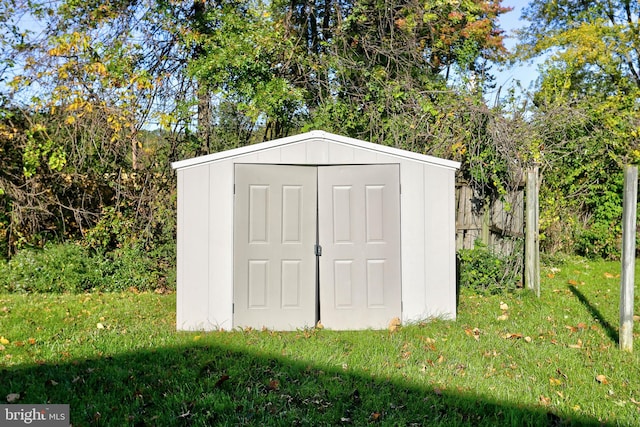 view of outdoor structure with a lawn