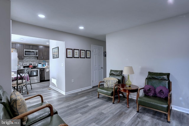 sitting room with light hardwood / wood-style floors