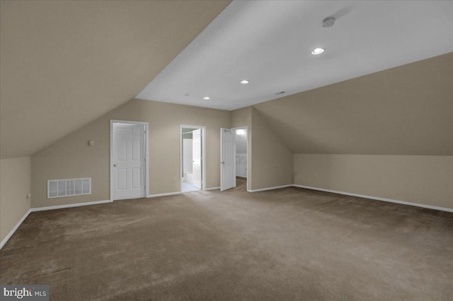 bonus room featuring lofted ceiling and carpet floors