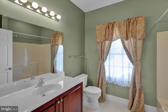 full bathroom featuring toilet, vanity, shower / bath combination with curtain, and tile patterned floors