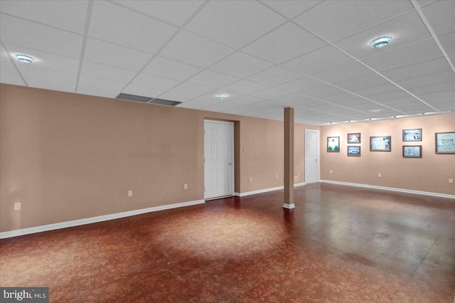 basement featuring a paneled ceiling