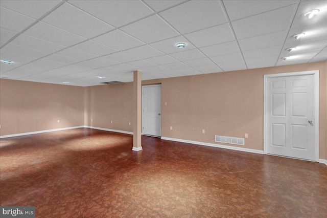 basement featuring a paneled ceiling