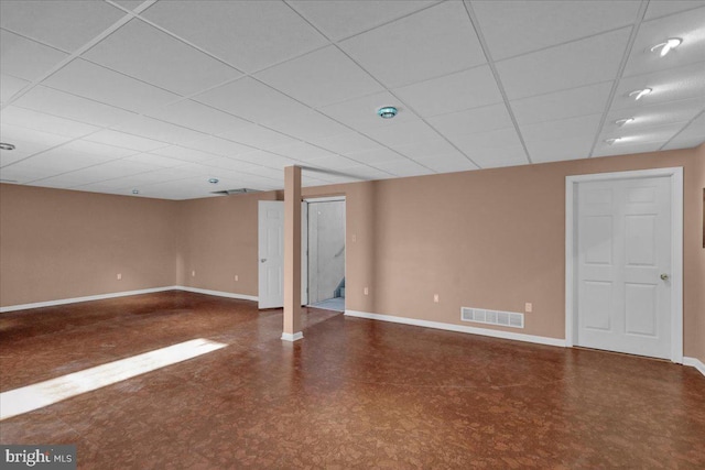 basement featuring a drop ceiling