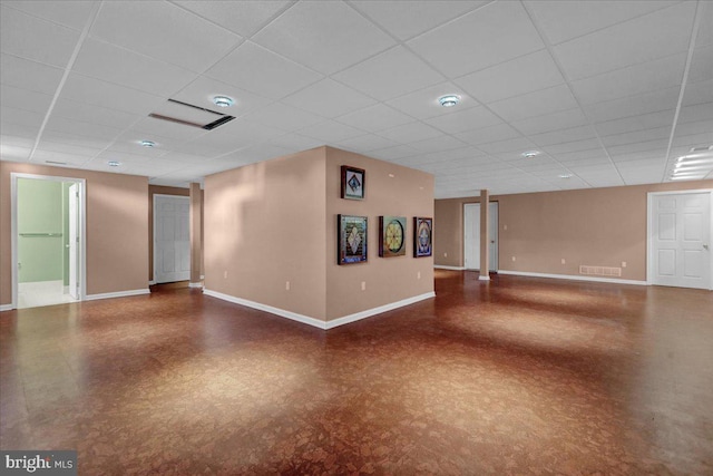 unfurnished room with a paneled ceiling