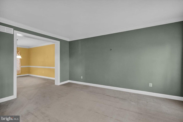 carpeted empty room featuring ornamental molding