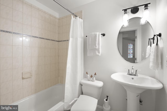 bathroom with toilet and shower / bathtub combination with curtain