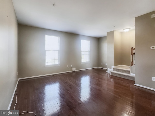 empty room featuring dark hardwood / wood-style floors