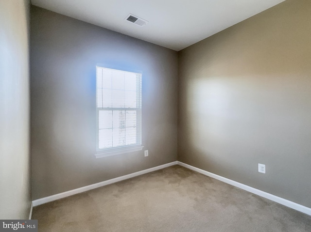 empty room featuring carpet flooring