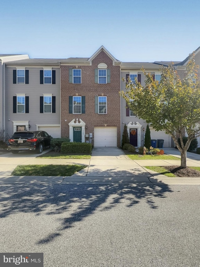 multi unit property featuring a garage