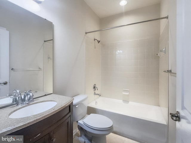 full bathroom with vanity, tiled shower / bath combo, toilet, and tile patterned floors