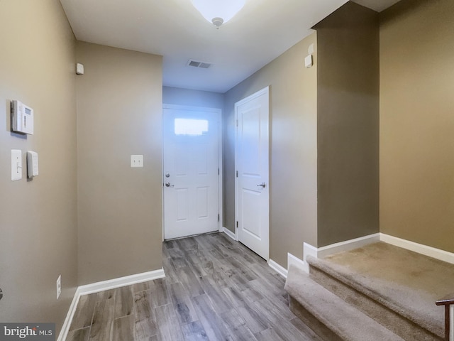 doorway to outside featuring light hardwood / wood-style flooring