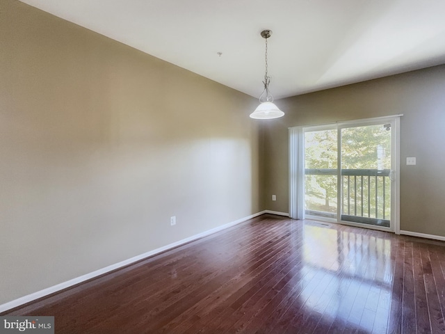 unfurnished room featuring dark hardwood / wood-style floors