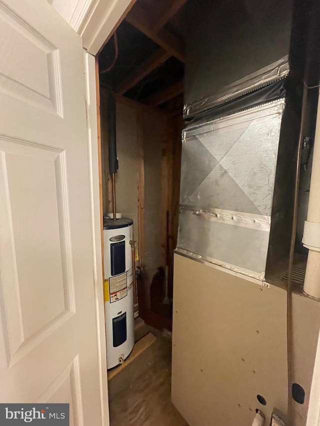 utility room with electric water heater