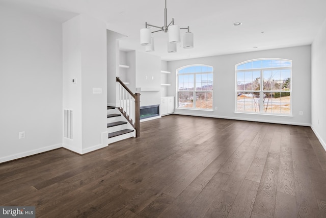 0 Triggerfish Dr, National Harbor, MD 20745 - unfurnished living room featuring stairs, dark wood finished floors, baseboards, visible vents, and recessed lighting
