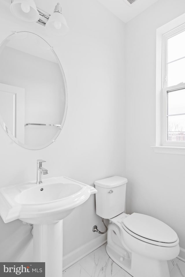 0 Triggerfish Dr, National Harbor, MD 20745 - half bathroom with marble finish floor, toilet, and baseboards