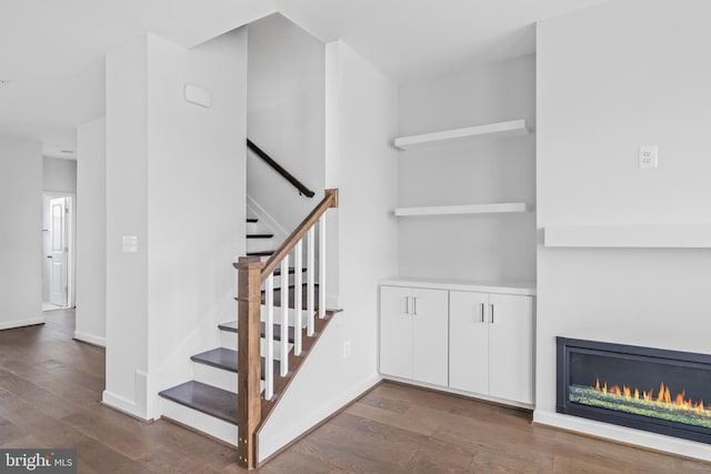 stairway featuring hardwood / wood-style floors